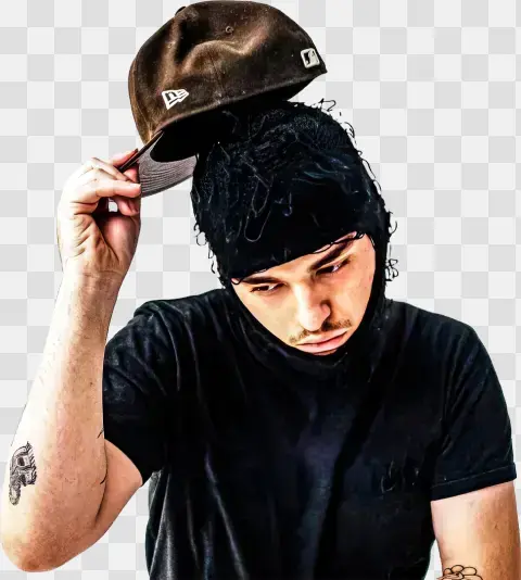Young Man Adjusting Cap And Balaclava